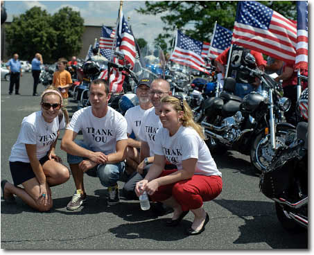 Lt. Sharon Hyland-Keyser, United States Marine Corps, poses with other military members at the rally location. Photo by Sean Carpenter.